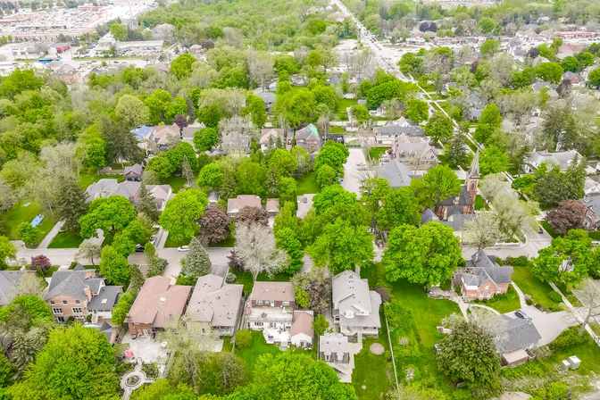 Aerial view of tree-lined residential streets and homes around Maple Lane in Unionville.